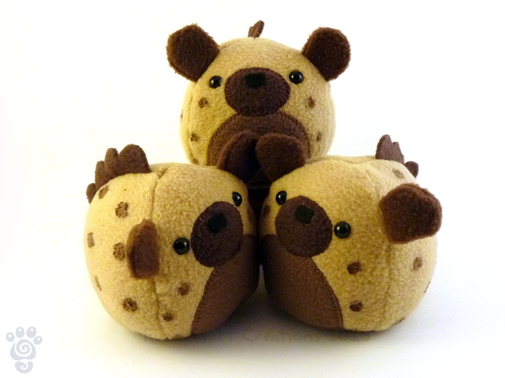 Product photo of 3 much older FuzziPuff hyenas, piled in a way to show various angles.