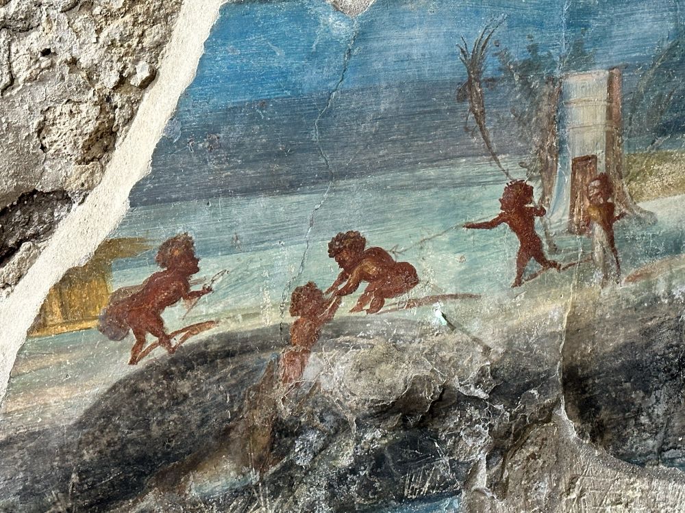Detail of the Nilotic scene with pygmies on the banks of the Nile one of whom appears to be squatting and pulling another from the jaws of a crocodile.