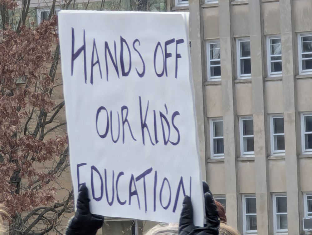 Protest sign: hands off our kids' education 