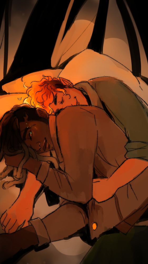 Wilder is holding Fox in a dimly lit tent, They both look happy and content.