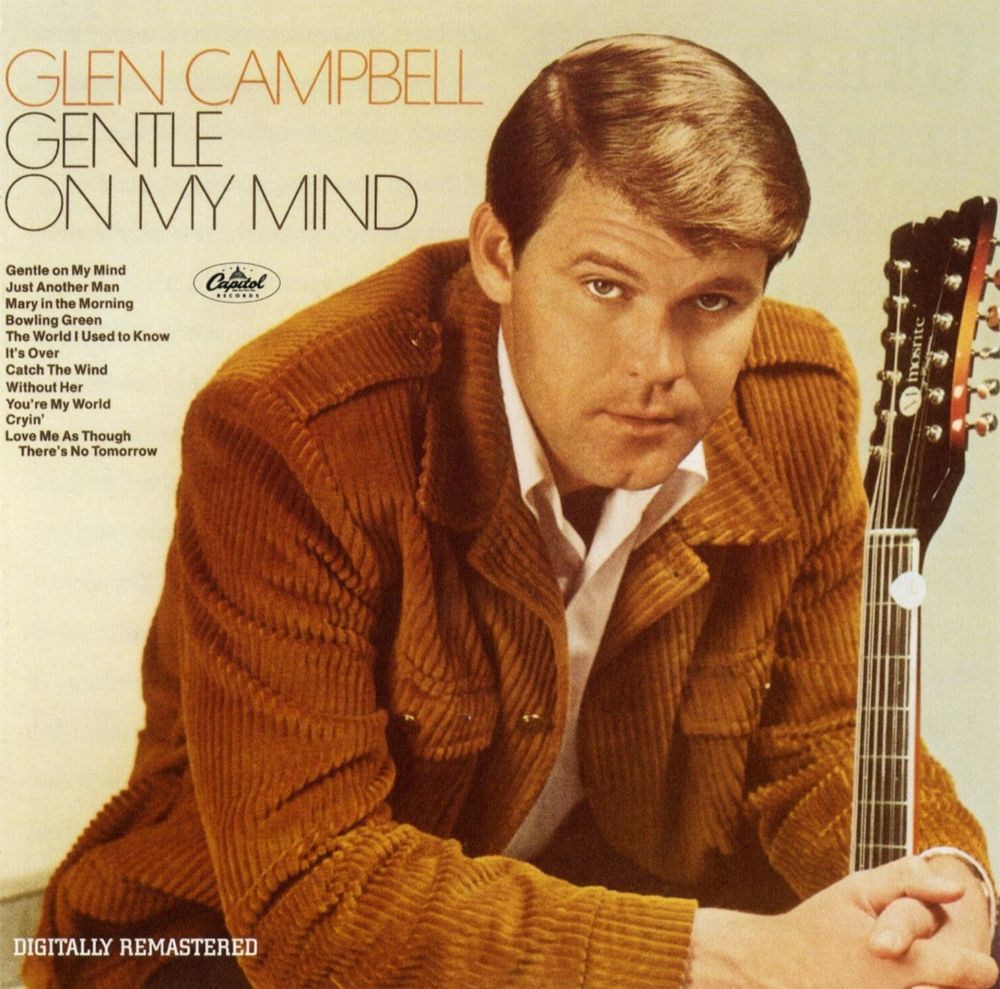 Cover art for Glen Campbell's "Gentle on my mind"
Glen is wearing an orangish brown corduroy jacket and holding a guitar