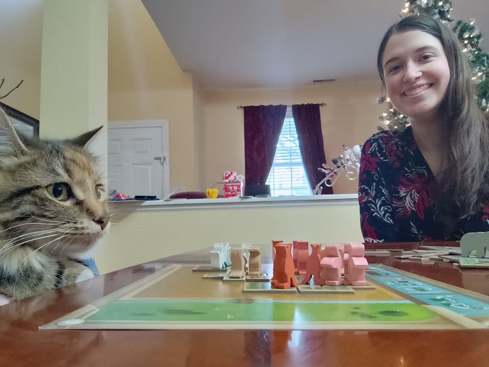 Young woman and cat during a game of New York Zoo.
