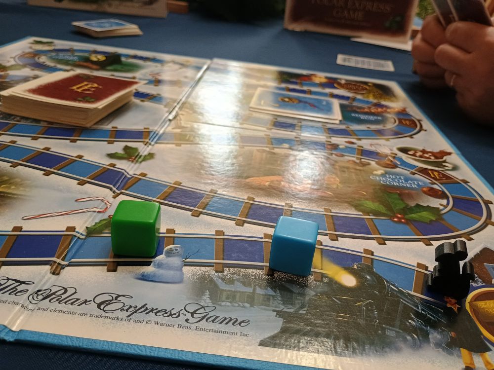 Polar express board game. The black rat meeple is from Everdell