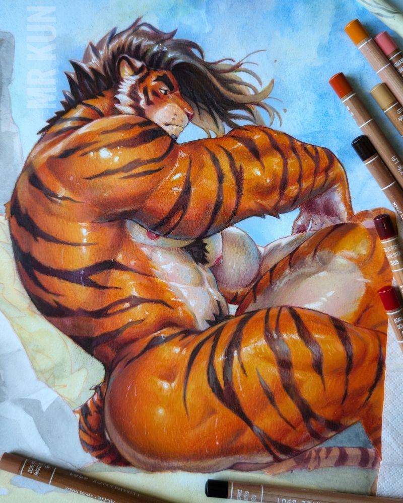 A work-in-progress traditional illustration of a muscular anthropomorphic tiger man sitting on a beach. His orange fur has bold black stripes. He glistens under the light, emphasizing the curves of his powerful body. He has long, tousled brown hair flowing in the breeze and a moody, distant gaze. His pose is relaxed but also commanding, with one arm infront of his head and the other on his knee. The background is a light wash of blue sky and soft clouds, with colored pencils scattered around the paper.