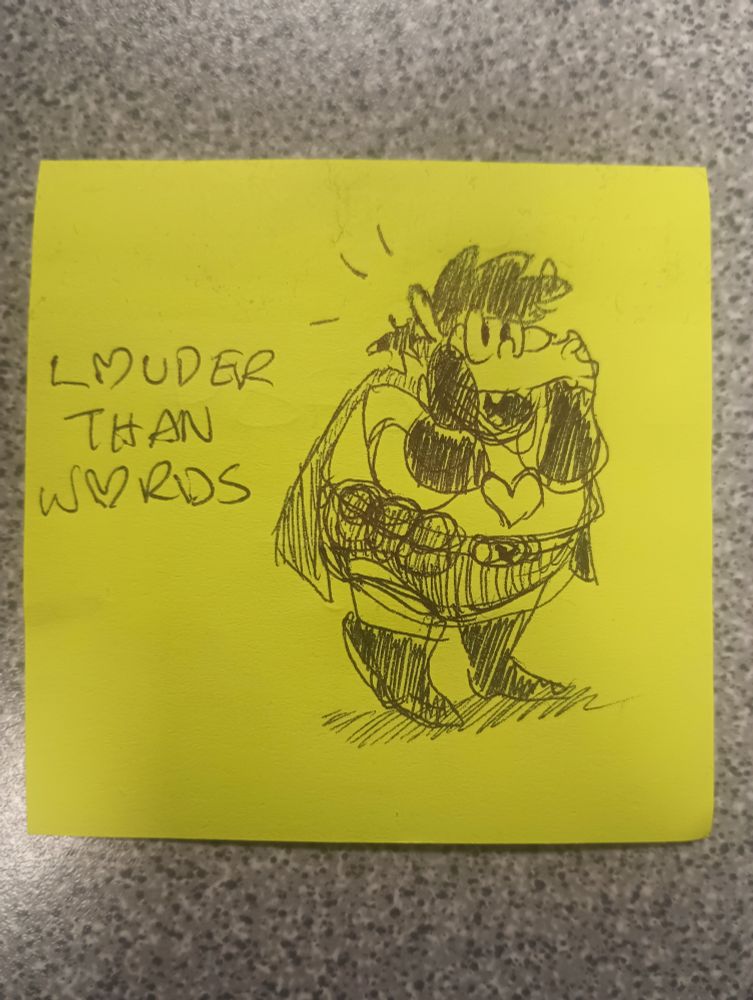 a sketch of my character on a sticky next to text displaying "Louder Than Words".