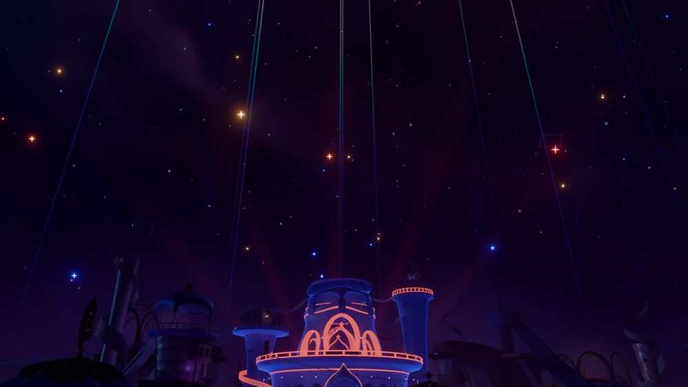 A night sky with a building illuminated in orange lights at the bottom of the photo. Shooting stars shoot upwards with various colors as twinkling lights illuminate the background