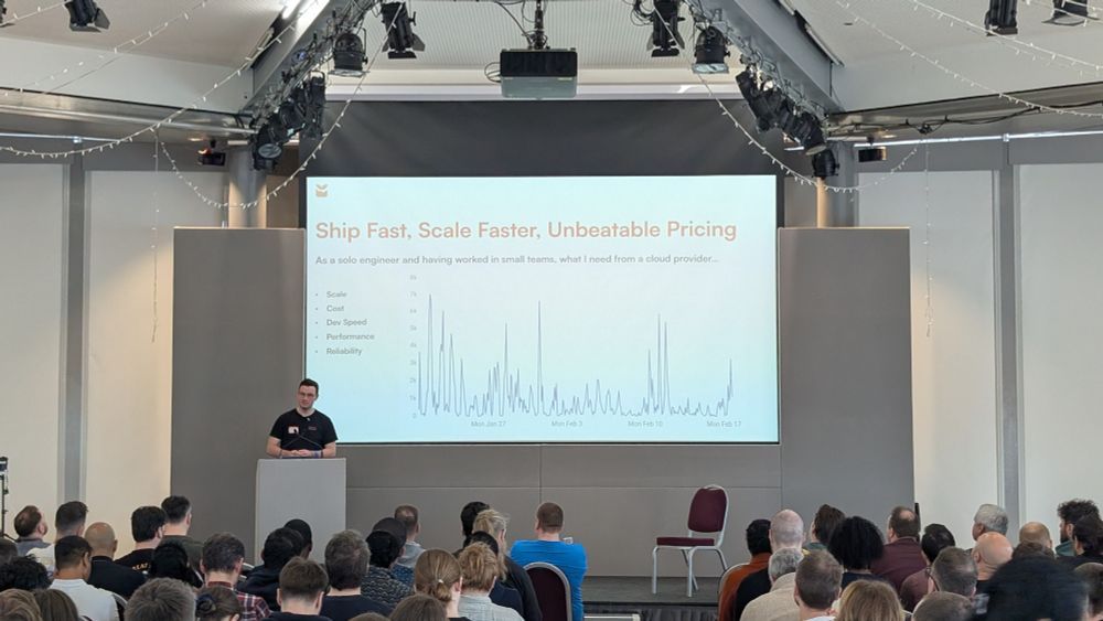 Me talking about what I'm looking for from a cloud provider, on stage in front of an audience