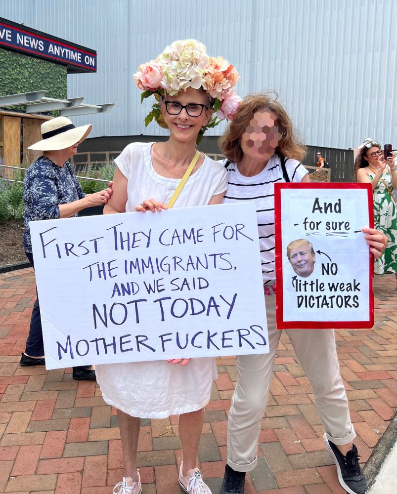 Sign saying’ “First they came for the immigrants, and we said, “NOT TODAY, MOTHERFUCKERS”