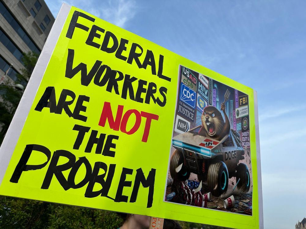 Protest sign: federal workers are not the problem 