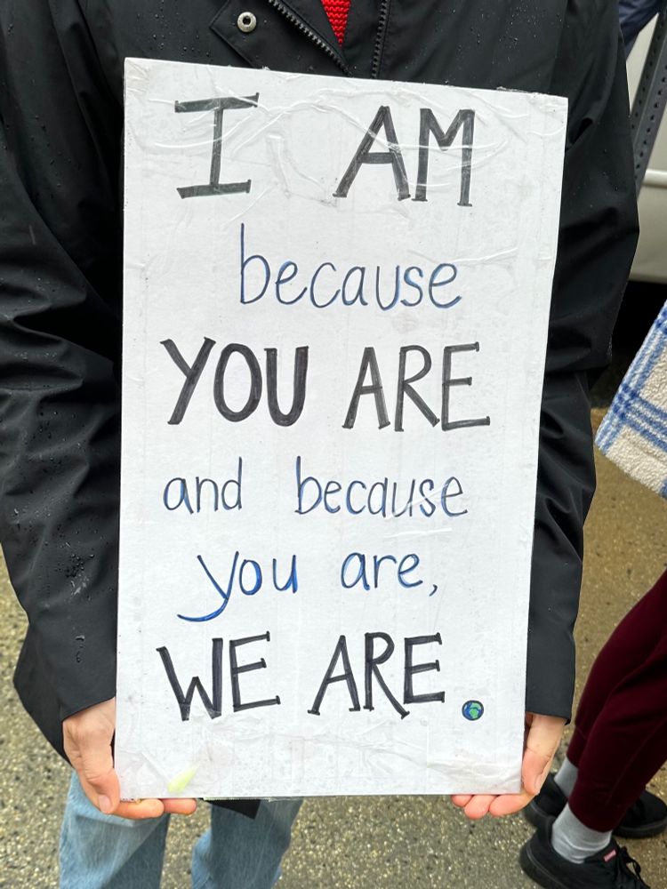 Protest sign: I am because you are and because we are