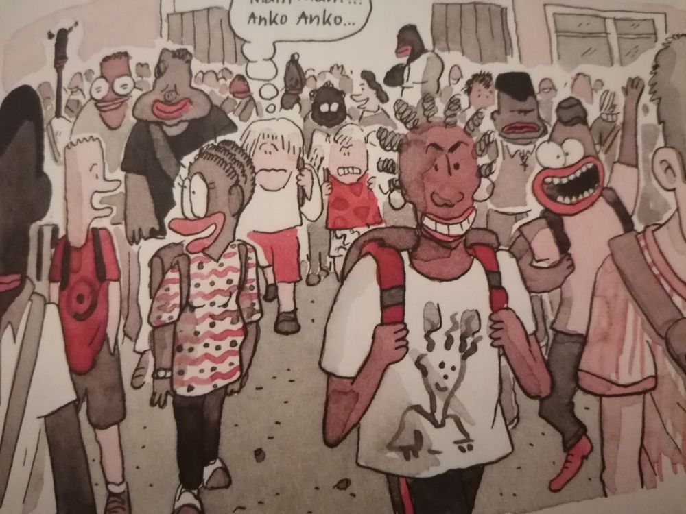 Une case tirée de la BD Pucelle tome 1, où l'on voit une foule, composée de beaucoup de personnes noires, toutes représentées avec de grosses bouches rouges. 