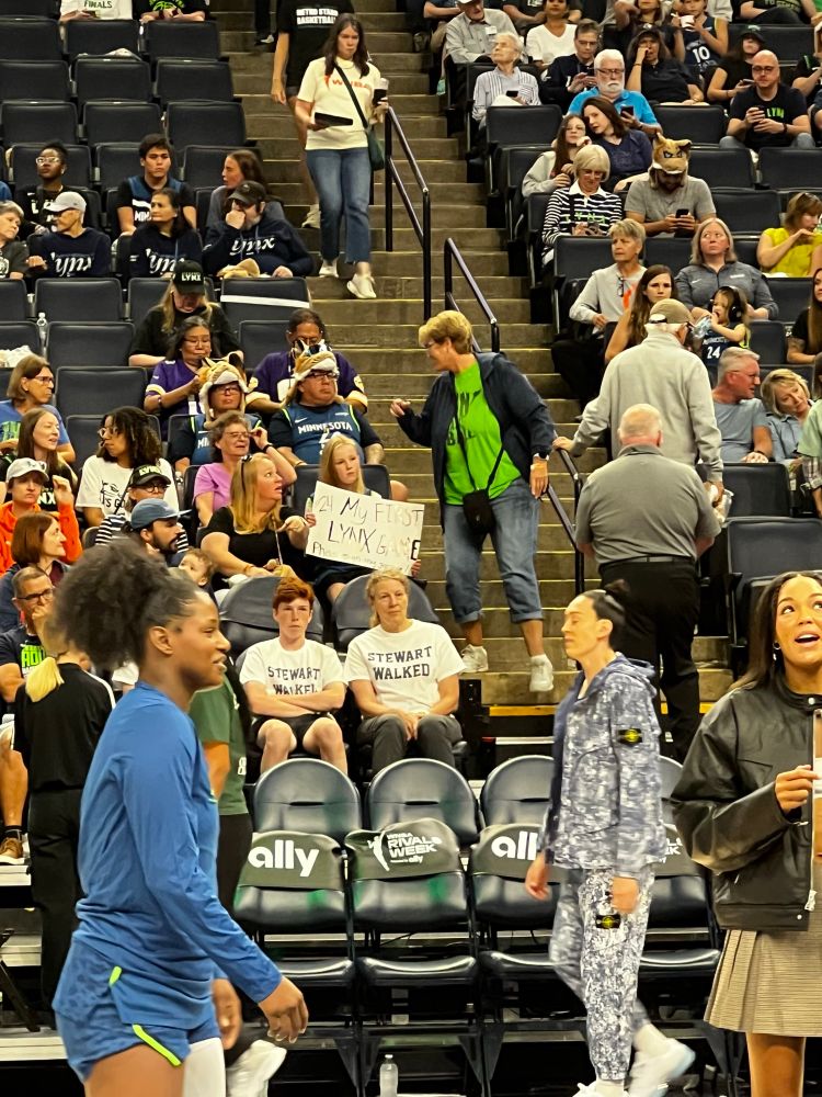 Stewie Walking past fans wearing Stewart walked t shirts 