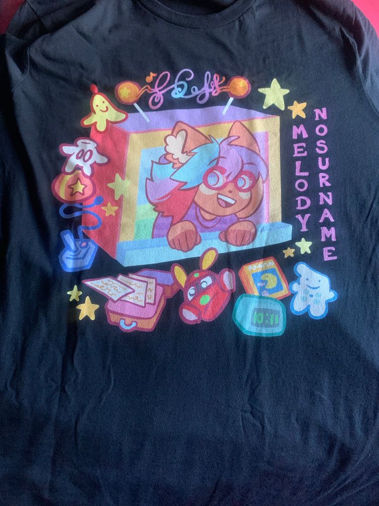 melody nosurname shirt on a flat surface