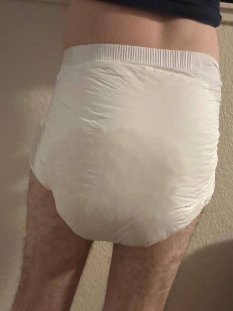 Guy in a soggy Str8up adult diaper.  View of butt.