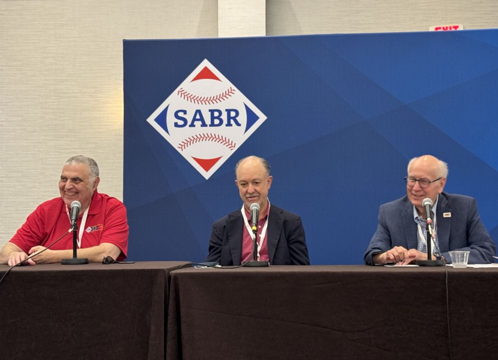 On Saturday, June 28, 2025, the Beckett Baseball Cards Panel was held at SABR 53 at the Westin DFW Airport Hotel in Irving, Texas. Panelists included, from left: Rich Klein, Dr. James Beckett, and moderator Paul Rogers.