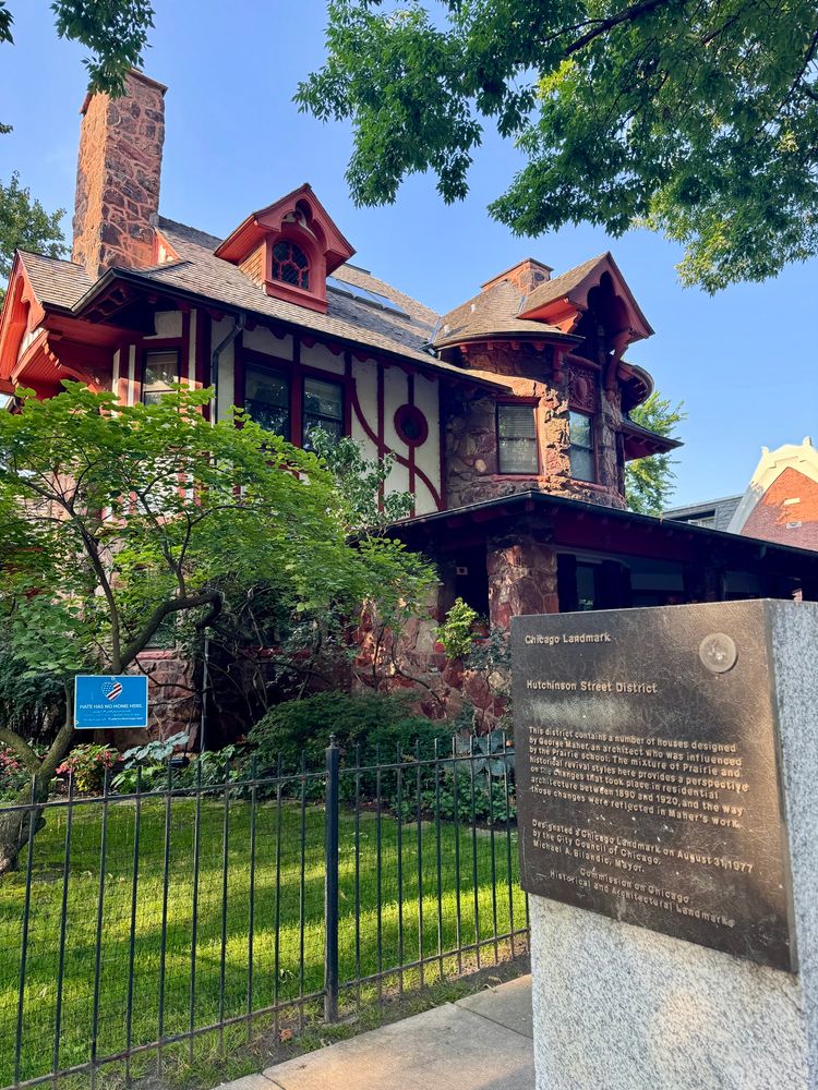 Historical marker erected on a concrete pillar on a sidewalk. Behind the marker is an iron fence and a large Queen Anne-style home designed by George W. Maher and built for Charles Scales in 1894.

The marker reads:

Chicago Landmark
Hutchinson Street District

This district contains a number of houses designed by George Maher, an architect who was influenced by the Prairie school. The mixture of Prairie and historical revival styles here provides a perspective on the Changes that took place in residential architecture between 1890 and 1920, and the way those changes were reflected in Maher's work.

Designated a Chicago Landmark on August 31, 1977 by the City Council of Chicago.

Michael A Bilandic, Mayor.
Commission on Chicago Historical and Architectural Landmarks