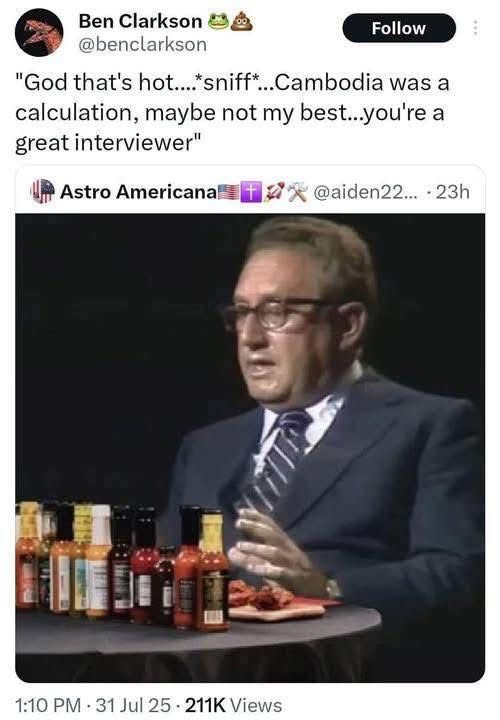 Picture of Henry Kissinger eating hot wings and discussing his actions in Cambodia. He can’t stay on message because the wings are so hot.