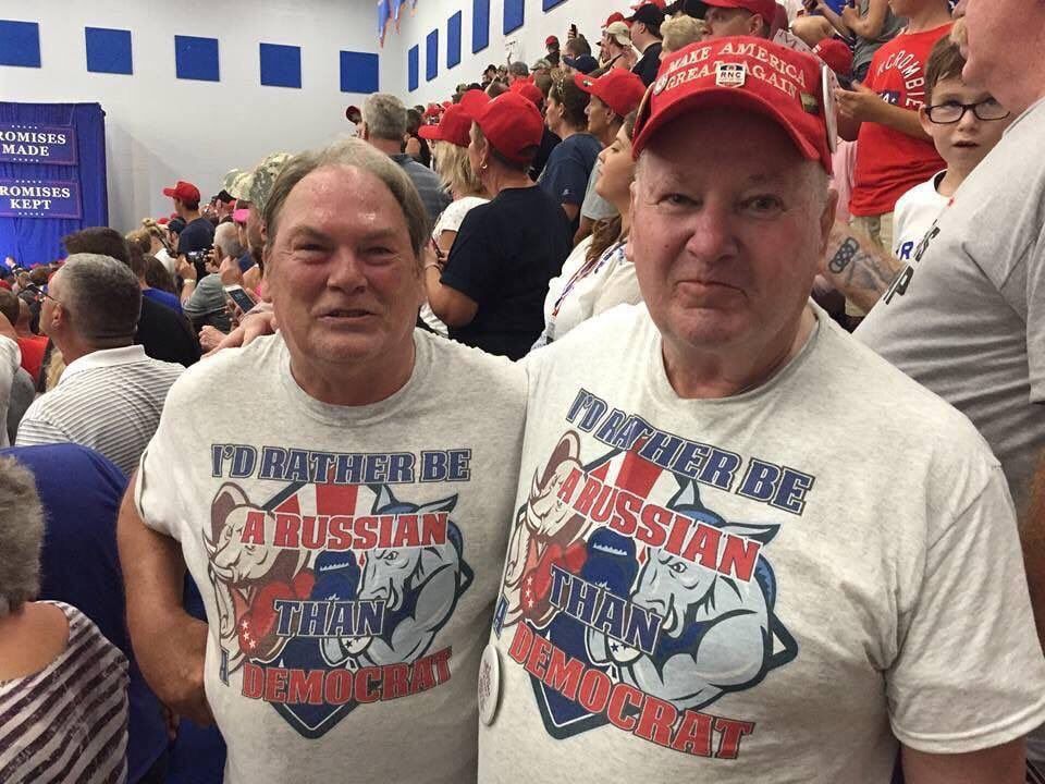 Two Trump supporters at an Ohio Trump rally wearing T-shirts that say: "I'd Rather Be A Russian Than A Democrat".

This picture was taken by Cleveland.com reporter Jeremy Pelzer at a Trump rally at the Olentangy Orange High School in Ohio on 4 August 2018.

"Pelzer identified the two men as James Alicie and Richard M. Birchfield..."

https://www.snopes.com/fact-check/russian-than-democrat-shirts/