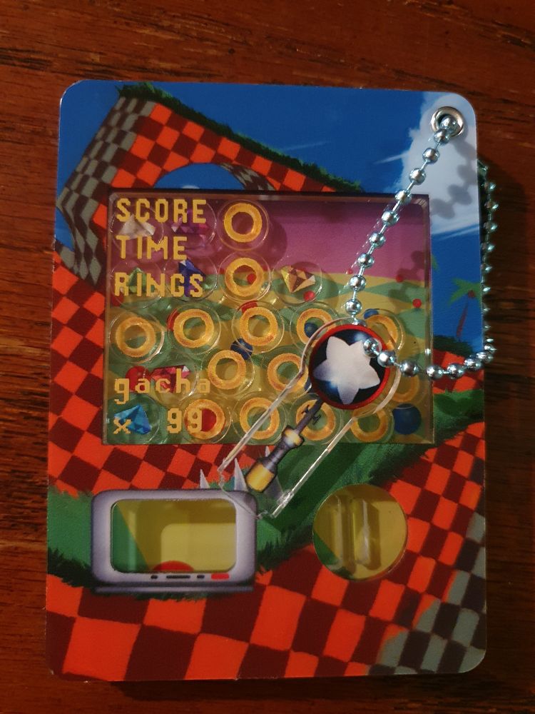 Sonic gachapon keychain. The star post operates the gacha lock.