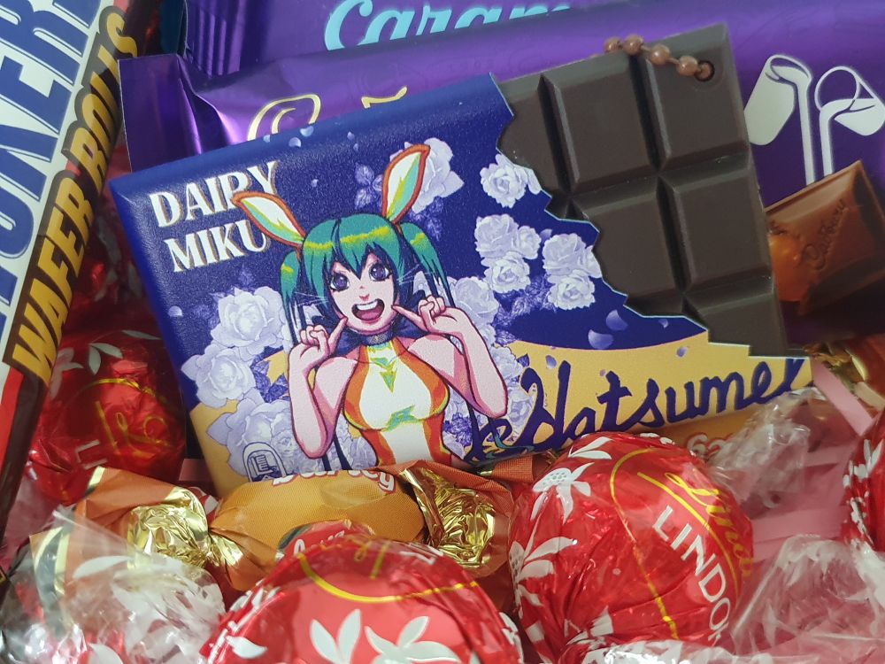 A Dairy Miku Hatsumel bar keychain. It is three dimensional.
