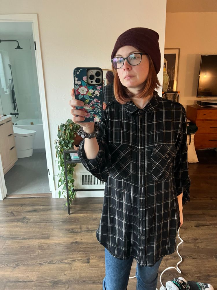 Galadriel takes a mirror selfie to establish her identity on a new account.