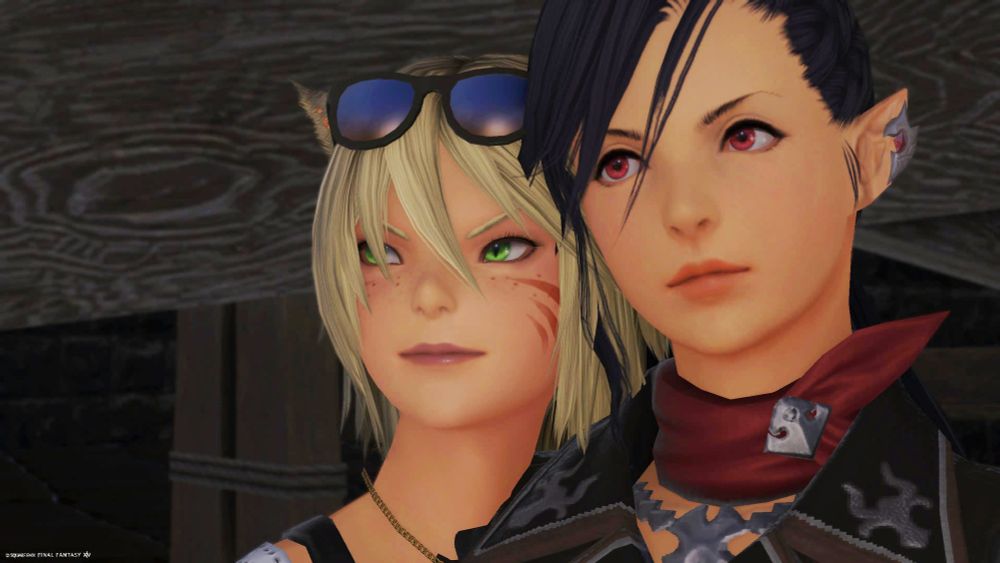 Reydiah and Hilda standing next to each other, looking off-screen to something on the viewer's left.