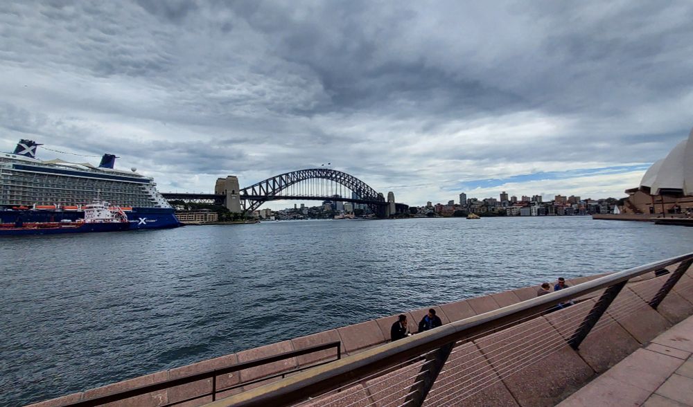 The Sydney Harbour Bridge and cruise port with a ceiling of clouds.