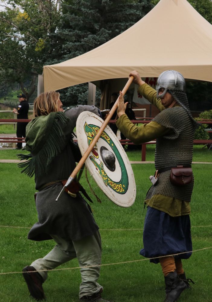 Two Vikings do battle to see who will win the skirmish.