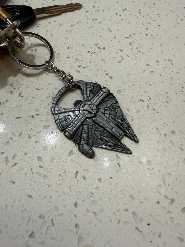 Picture of a silver Millenium Falcon keychain 