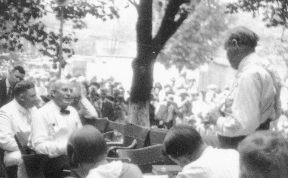 William Jennings Bryan (seated at left in the bow tie) being questioned by Clarence Darrow during the trial of the State of Tennessee v. John Thomas Scopes, July 20, 1925. The court proceedings were moved outdoors that day by the judge because of the extreme heat. (Photo credit: Smithsonian Institution Archives)

