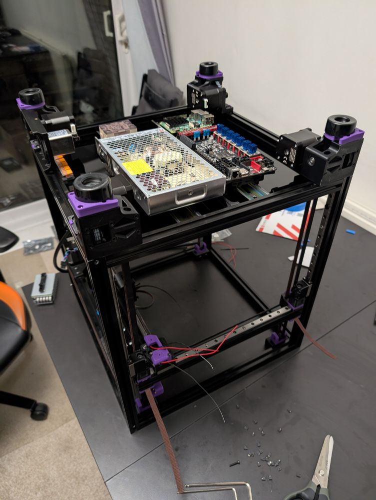 Photo of an upside down Voron 2.4 showing the electronics bay 