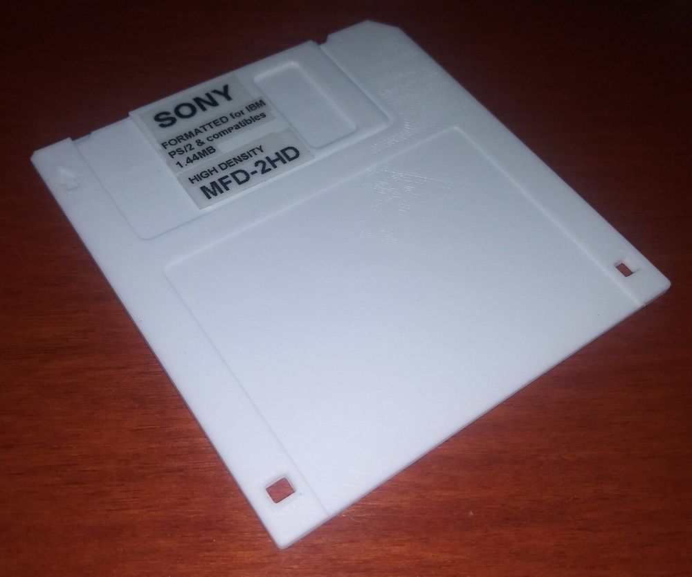 Picture of a 3D printed 3.5" floppy disk, with printed labels stuck on to make it look as though it is a Sony branded HD floppy disk.