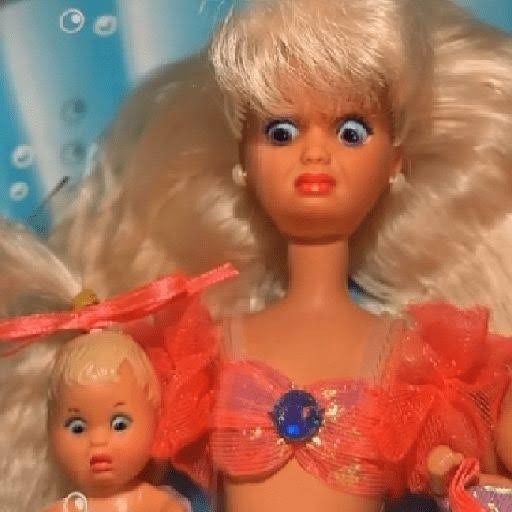 Barbie doll and a baby Barbie doll looking shocked 