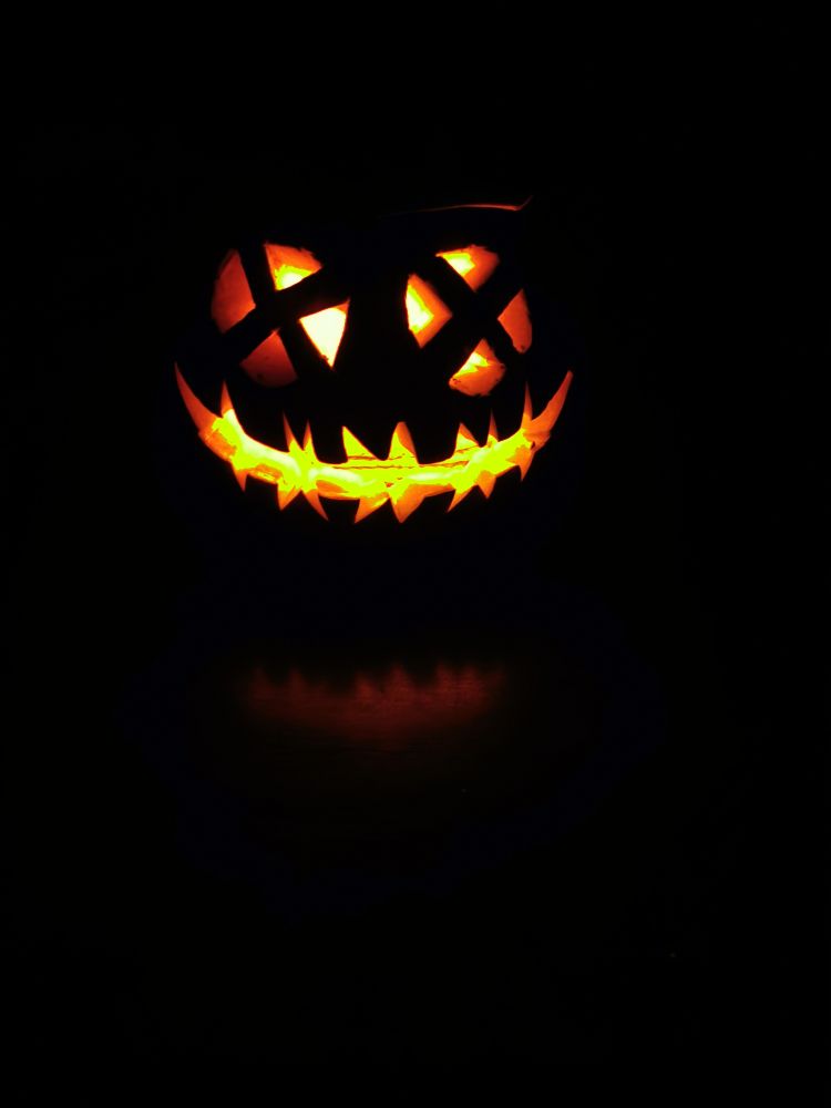 Pumpkin lantern lit in the dark
