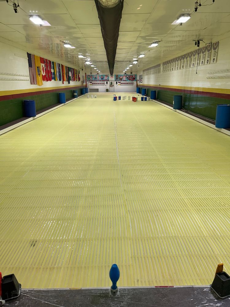 2 sheet curling club starting to put ice in. Cooling mat tubes showing 