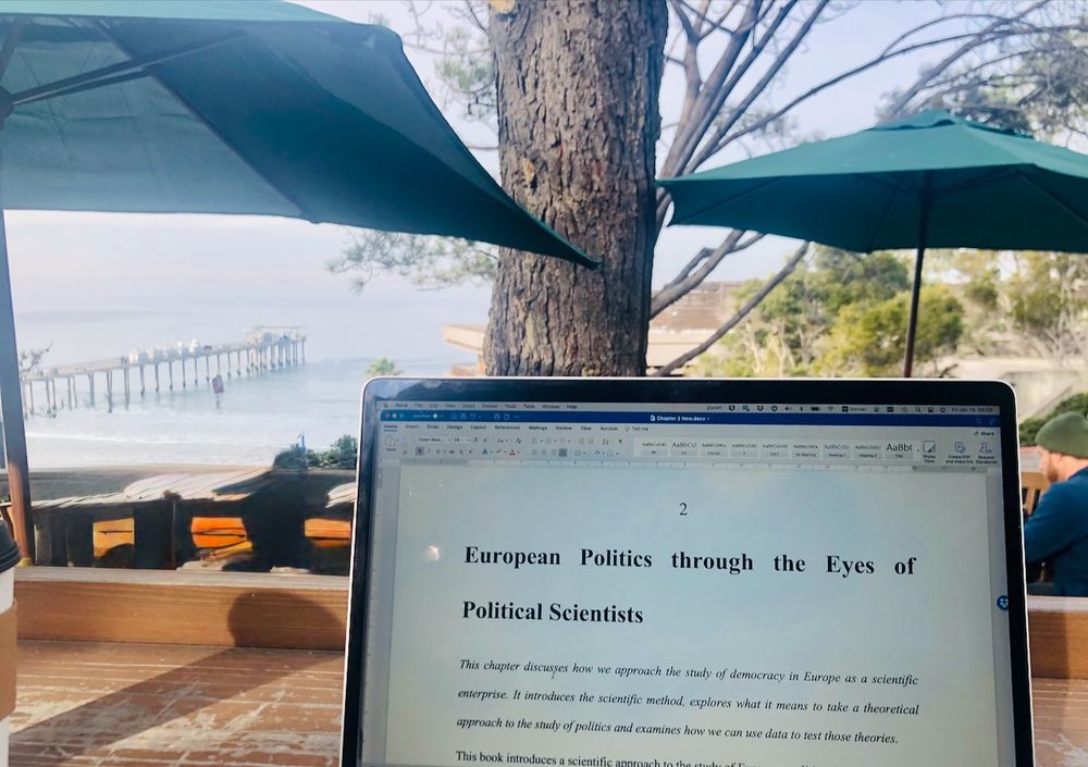Laptop in an outside cafe overlooking Pacific ocean
