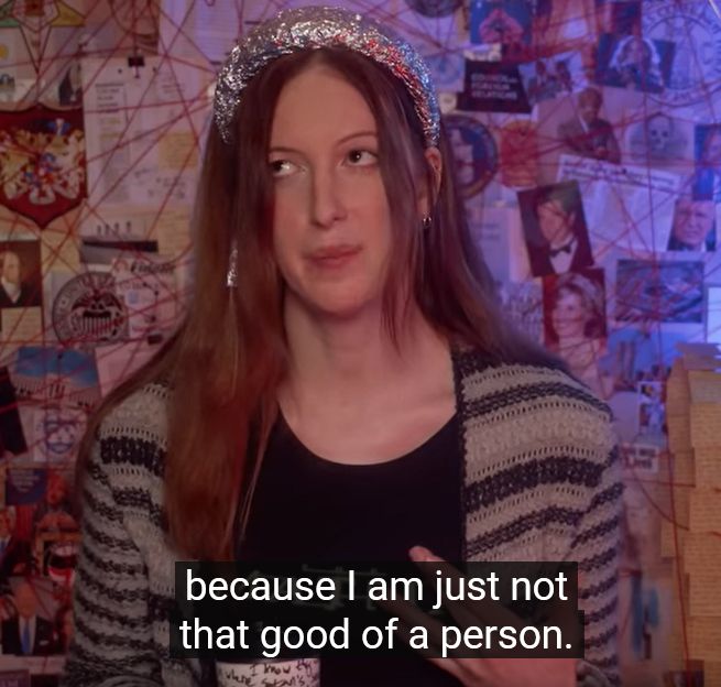 A screencap of Contrapoints' "Conspiracy" video in which she is sitting in front of a conspiracy board with subtitles of her saying "Because I am just not that good of a person.
