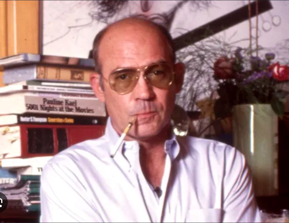 A photograph of Hunter S. Thompson, who wrote great political obituaries, among other things.