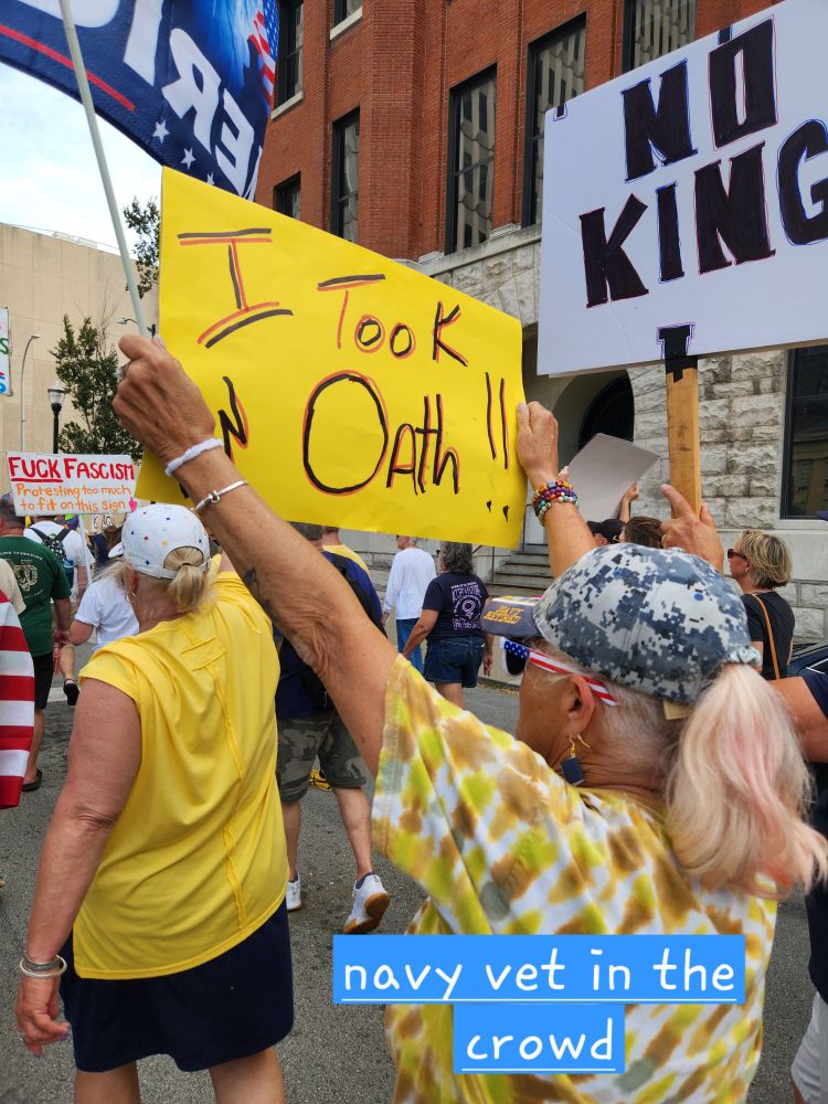 Veteran with sign saying "I took an oath"