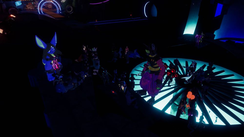vrchat screenshot of the dance floor at club fynn at furality umbra, with many furries strewn about the dancefloor