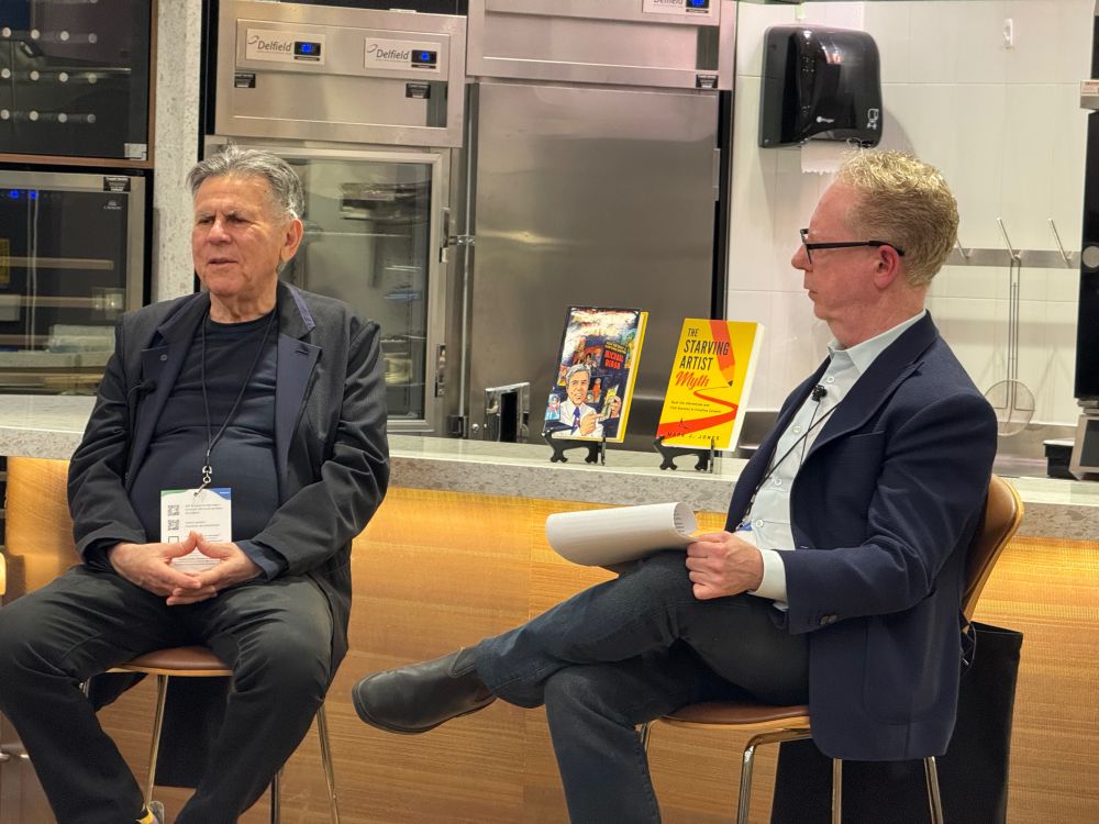 Michael Hirsh in conversation with Mark Jones with their respective books Animation Nation and The Starving Artist Myth in the background 