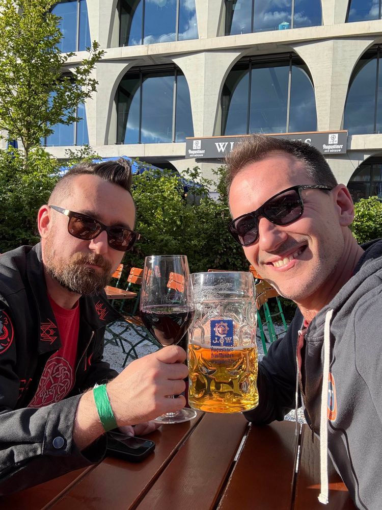 Me and a mysterious grumpy person whose name starts with a ? in a beer garden. 