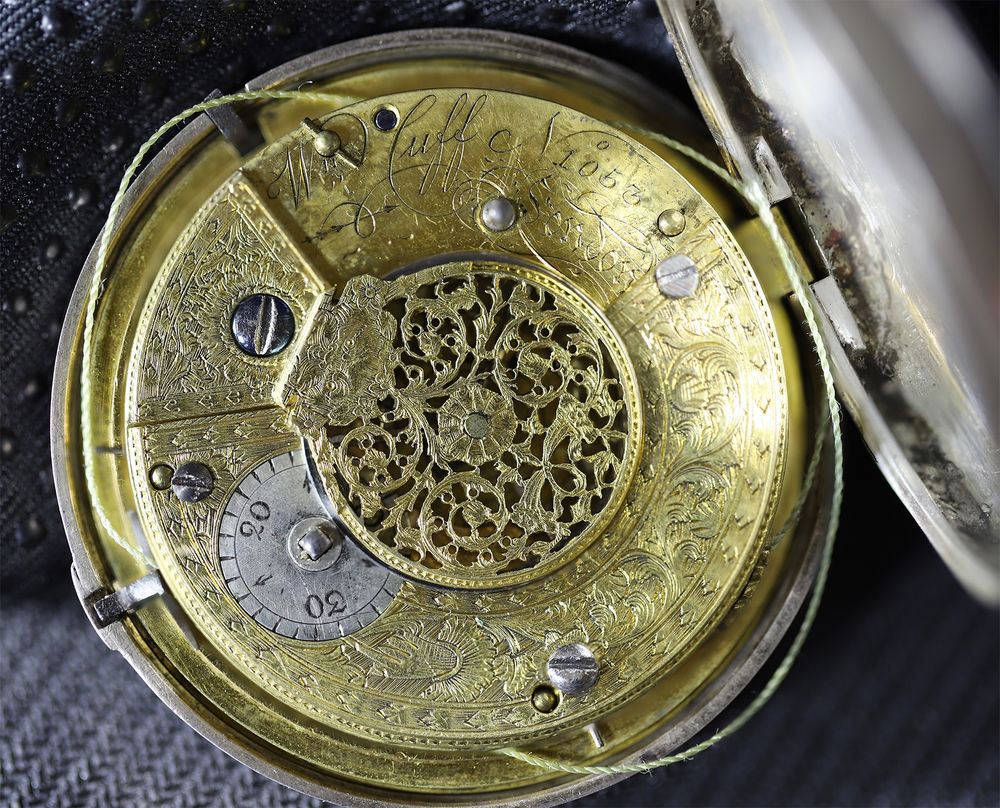 View of the open back of a pocket watch (circa 1800 London) engraved Wm Cuff London No 1052