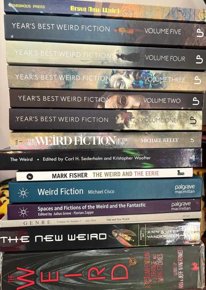 A stack of a lot of books of/on weird fiction