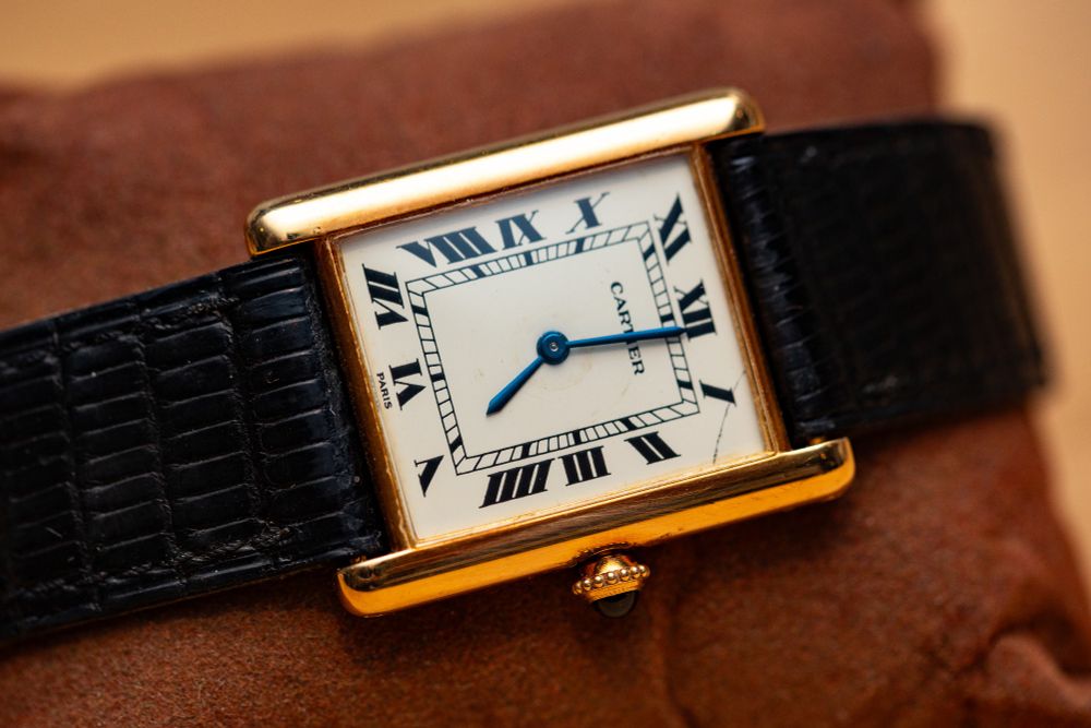 A gold Cartier Tank watch