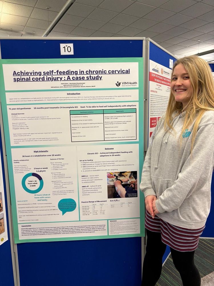 Sophie is stood next to her extra large poster size (A0) 