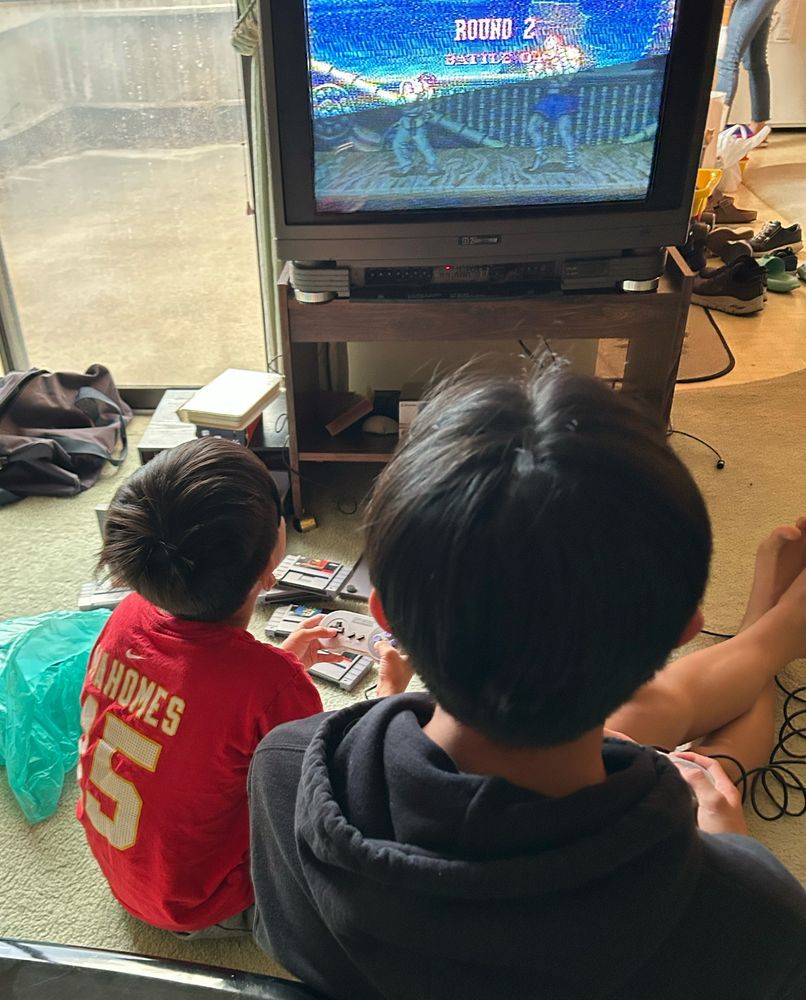 Kids playing street fighter 2 turbo on the SNES