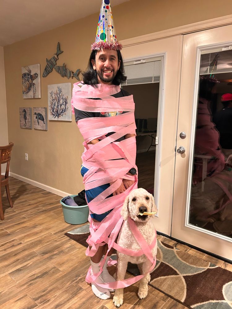 Me and the pup wrapped in pink tissue paper. 