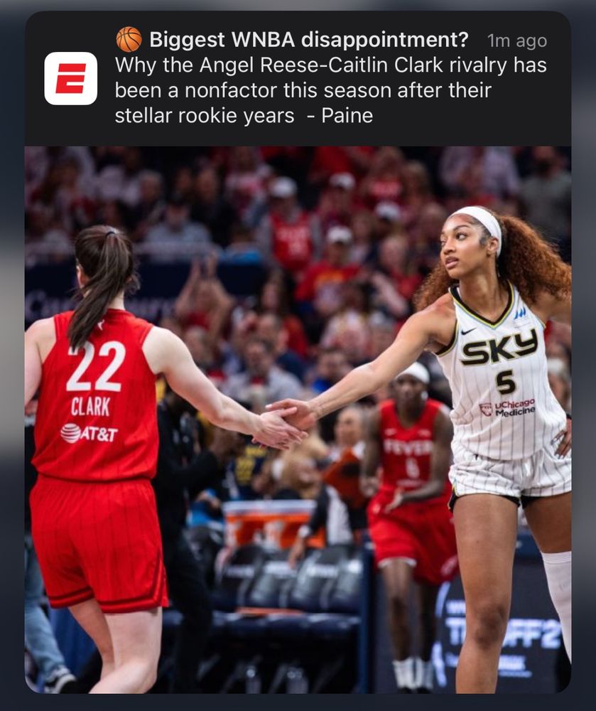 An ESPN push notification. Biggest WNBA disappointment? Why the Angel Reese-Caitlin Clark rivalry has been a nonfactor this season after their stellar rookie years - Paine. Below, a photo of Clark and Reese in their respective team jerseys high-fiving during a game.