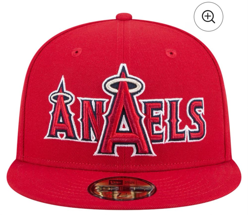 A baseball hat design that layers the team logo on top of the team name/wordmark. This particular example is for the Angels. The positioning of the logo makes it look like a nonsensical word “AnAels” which is very close to the word “anals.”